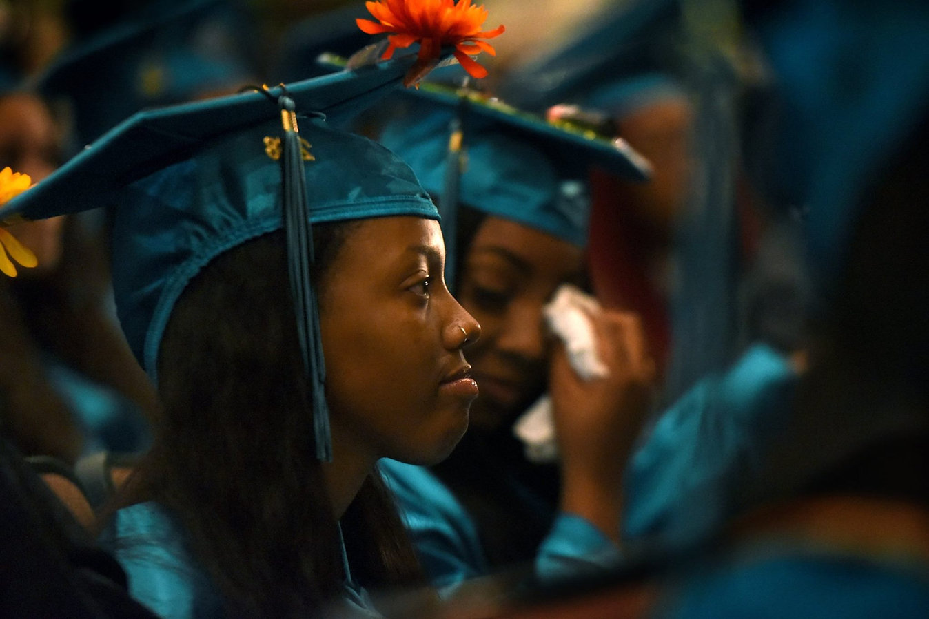 A graduate in a cap and gown during a commencement ceremony.